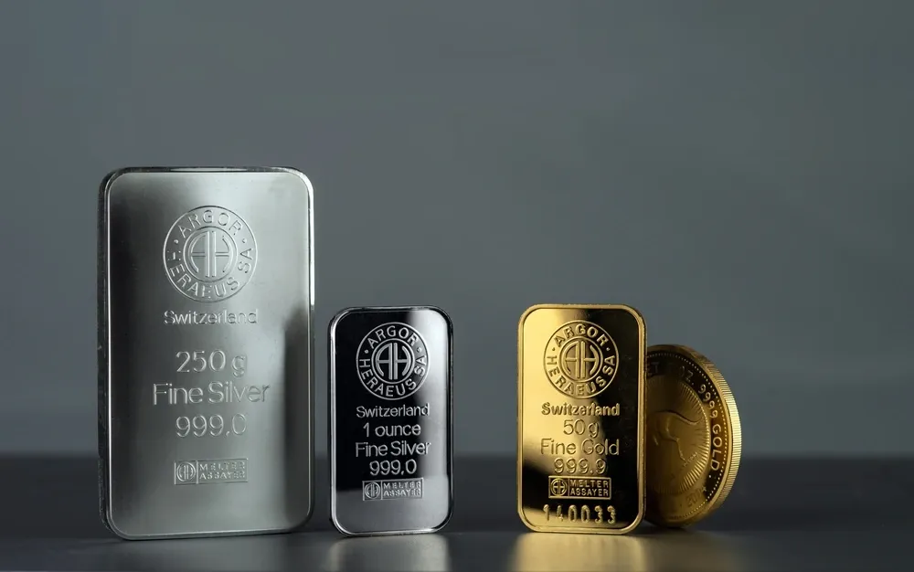 Gold slips from record high levels in early trade, silver falls for 2nd day